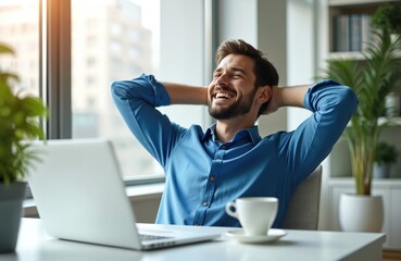 Happy businessman relaxing in modern office chair. Satisfied male employee enjoys break after successful work on laptop. Young man smiles, feels peace, job satisfaction, leaning back at bright