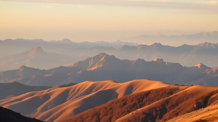 Fototapeta premium A serene mountain landscape bathed in golden hour light, showcasing nature's grandeur.