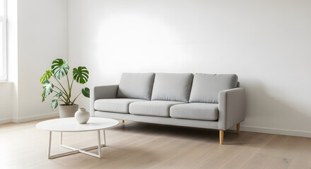 Modern living room with stylish grey sofa and plant for comfortable home vibes