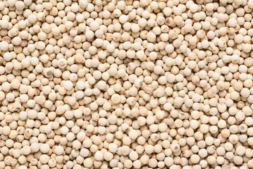 White pepper seeds texture background, spice ingredient for Asian cooking such as Thai and Indian food