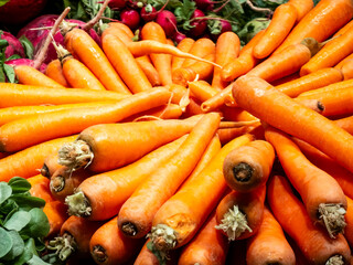 Fresh organic carrots on display at a local farmers market