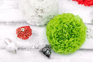 Traditional New Year composition. Festive decor, handmade paper flowers, gift idea. Holiday time