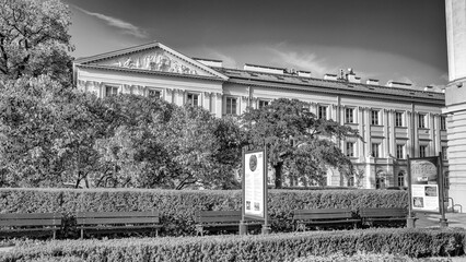 Urban photography of Warsaw University showing landscaped gardens surrounded by academic buildings