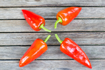 red hot chili peppers on wooden background