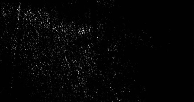 High contrast distressed surface with random white splatters on deep black background