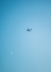 passenger airplane flying above blue sky