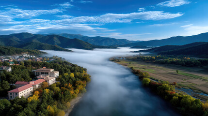 Obraz premium Aerial view misty autumn morning river valley forest mountain blue sky tranquil landscape scenic nature peaceful