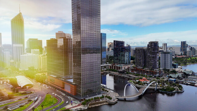 Elizabeth Quay pedestrian bridge in Perth glowing at sunset with vibrant evening city lights
