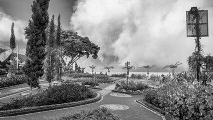 Scenic view of Pura Ulun Danu Beratan Bedugul temple surrounded by lake and misty highlands in Bali