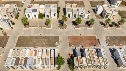 Aerial view of an Italian cemetery with small private chapels.