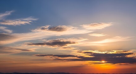 Golden Hour Glory: The Sun's Descent Through a Tapestry of Clouds The Warm, Fading Light of Sunset Across the Clouds