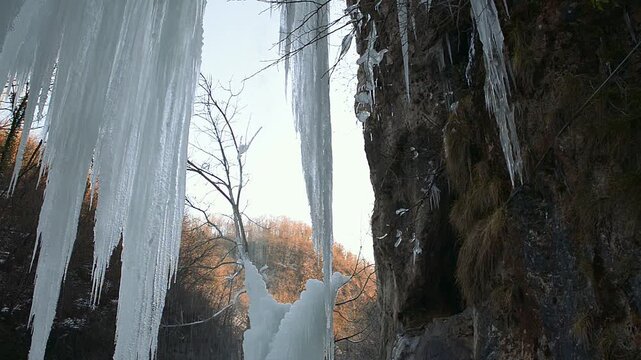 Frozen waterfall, winter landscape. Ephemeral, cold and winter concept. Located in Valganna, province of Varese, Italy. Area known as the Valganna caves for the presence of caves of karstic origin