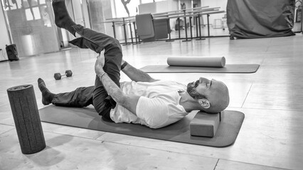 Physical rehabilitation exercises for legs in the gymnasium