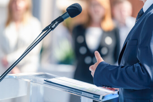 Male politician at press conference delivers a compelling vision, engaging media. His clear articulation ensures accurate reporting and builds public trust in policy matters.