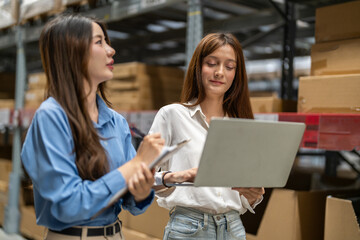 Asian warehouse staff teamwork, supply chain logistics management, shipping inventory check with laptop and clipboard, modern e-commerce b2b fulfillment, smart warehouse system wms operation, industry