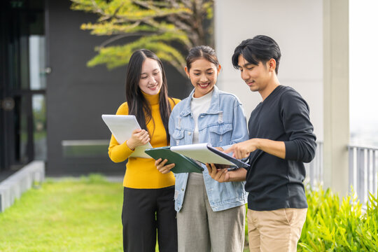 Startup creative design and production house, young asian team brainstorming ideas in coworking space collaborating on project, business branding teamwork productivity at office, professional growth
