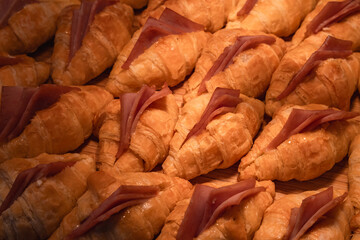 Delicious savory croissant with ham and cheese, perfect breakfast or lunch pastry from bakery....