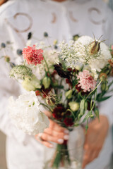 a bouquet in the bride's hands