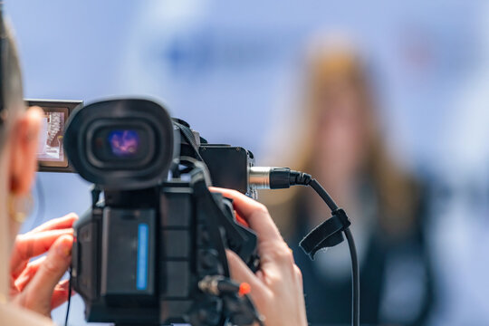 Camera at press conference records key statements, ensuring accurate media coverage. Its precise footage preserves critical details, supporting transparent public communication.