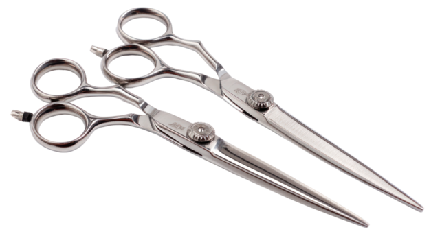 Two silver professional hair cutting scissors isolated on transparent background
