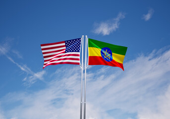 flags of  ethiopia and United States of America over blue sky background.