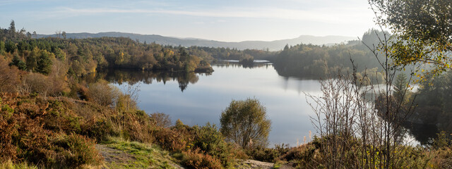 Welsh lake surrounded by forest in Fall