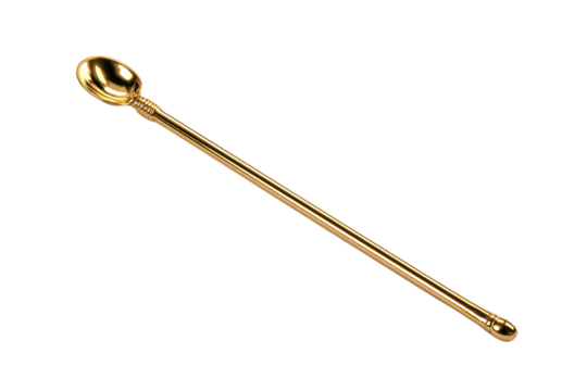 A gold spoon with a handle is sitting on a white background. The spoon is long and slender, with a rounded end. The spoon appears to be a decorative piece, possibly used for serving or stirring