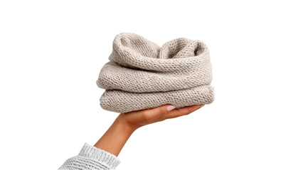 Folded Knitted Sweater Held in Hand on White Background