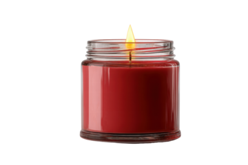 A red candle is lit in a clear glass jar. The candle is lit and the flame is yellow