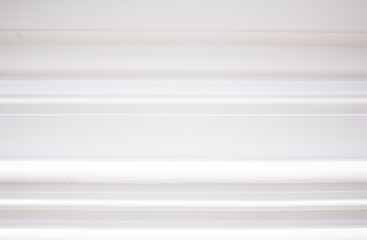 Fototapeta premium White window blinds on the white wall. Abstract background and texture for design.