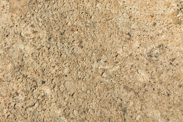 表面にたくさん穴の空いた茶色い石のクローズアップ。石や岩のテクスチャー。