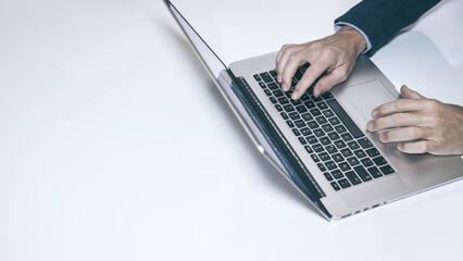 Efficient Work Flow: A High-Angle View of a Professional Typing on a Laptop