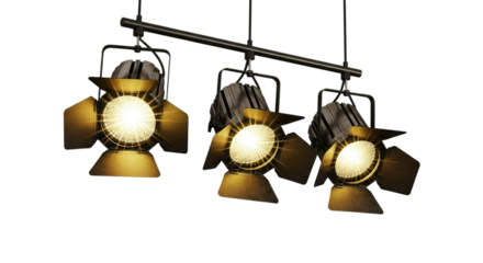 Three gold spotlights hanging from a black bar isolated on transparent background, providing bright illumination for a stage