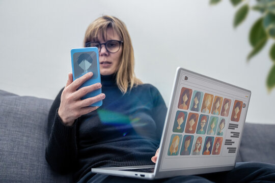A woman enjoys a virtual meeting, video call with colleagues or friends using smartphone. Modern communication and collaboration, remote work, social connection. Online remote work, social networking - Powered by Adobe