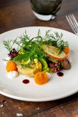 Heirloom tomato salad with grilled squash and fresh herbs
