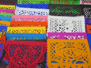 variety of traditional colorful mexican paper garlands - papep picado for sale in a market in Mexico