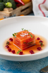 Layered tomato and beet terrine with herbs and seasoning