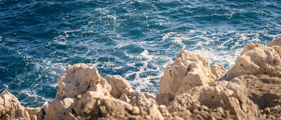 waves on the cliff and rocks beach