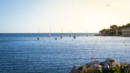 boats on the sea at sunset