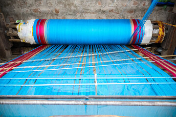 Fototapeta premium Vintage Handloom equipment or traditional setup for weaving. Cotton saree handloom and yarn.