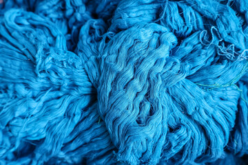 Blue cotton yarn, handloom raw material. Hand-dyed skeins of yarn used for weaving.