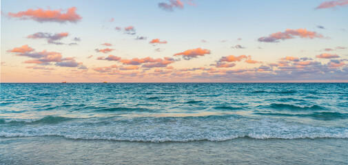 Sunrise with sea beach. Dramatic sunrise horizon at sea. Romantic summer vacation on sunset...