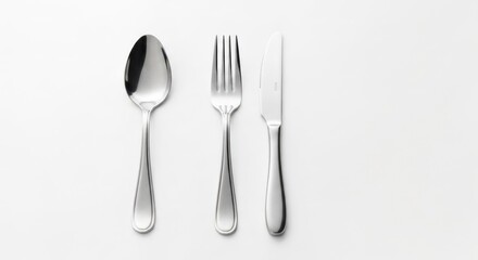 Silverware Spoon, fork, and knife neatly aligned on a white background