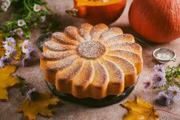 Pumpkin pie on a brown background. Delicious pumpkin pie for dessert. Close-up