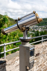 Cochem, Germany - September 9, 2025: Tourist telescope on an observation deck with a view of the Moselle Valley.
