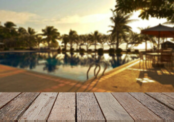 Wooden table top on the beach or sea. swimming pool Party on the beach  sunshine time concept.For montage product display or design key visual layout.View of copy space.