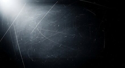 Abstract dark background with bright light beam and scattered dust particles