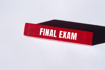 Final exam message written on wooden block background. Conceptual Final exam symbol. Copy space.