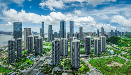 Aerial view of a modern residential district with high rise apartment towers and a dense financial center in Zhuhai.