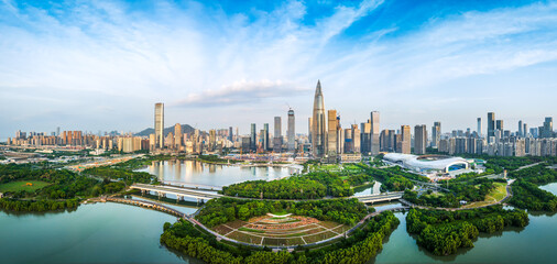 Panoramic the modern financial district skyline with a large green waterfront park in Shenzhen,...